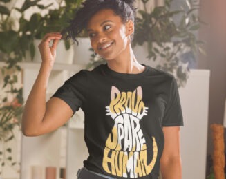 Black Proud Spare Human T-shirt worn by smiling woman, a funny and stylish Persian cat gift idea for cat parents