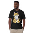 Man wearing black Proud Spare Human shirt—funny unisex T-shirt for Persian cat dads and pet lovers