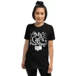 Woman modeling black "My Cat’s Plus One" shirt with natural curls and confident smile