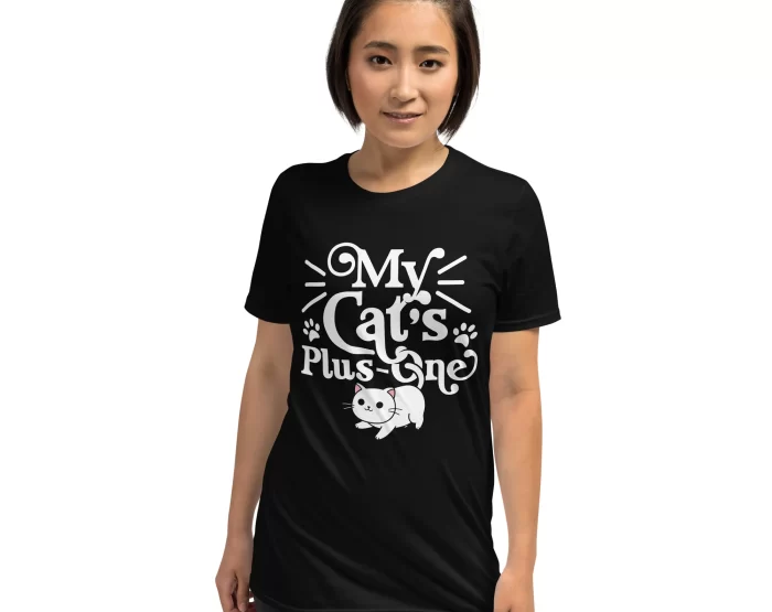 Woman modeling black "My Cat’s Plus One" shirt with natural curls and confident smile