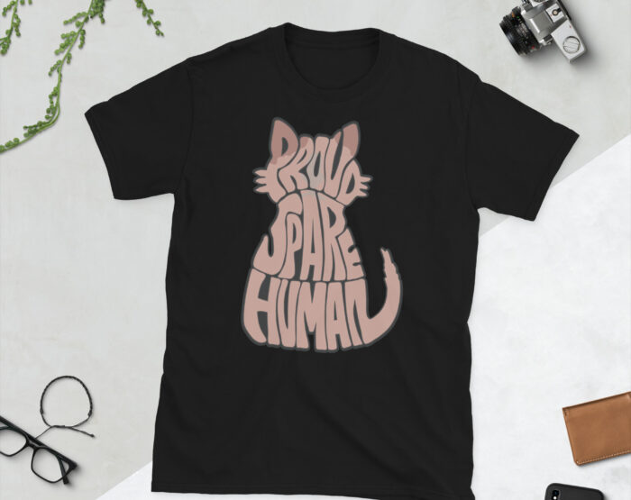 Black Sphynx Cat T-Shirt Flat Lay with Accessories Black Sphynx cat t-shirt with Proud Spare Human cat design displayed flat with camera and pen