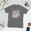 Flat lay of Graphite Heather Certified Can Opener tee with plant and scissors on white background