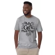 Man modeling gray "My Cat’s Plus One" shirt standing in casual pose