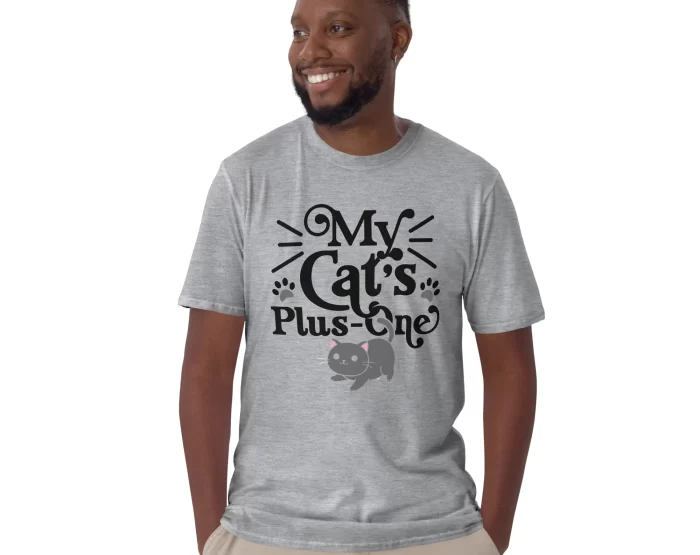 Man modeling gray "My Cat’s Plus One" shirt standing in casual pose
