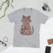 Light gray Sphynx cat t-shirt laid flat with bold Proud Spare Human design in cat silhouette