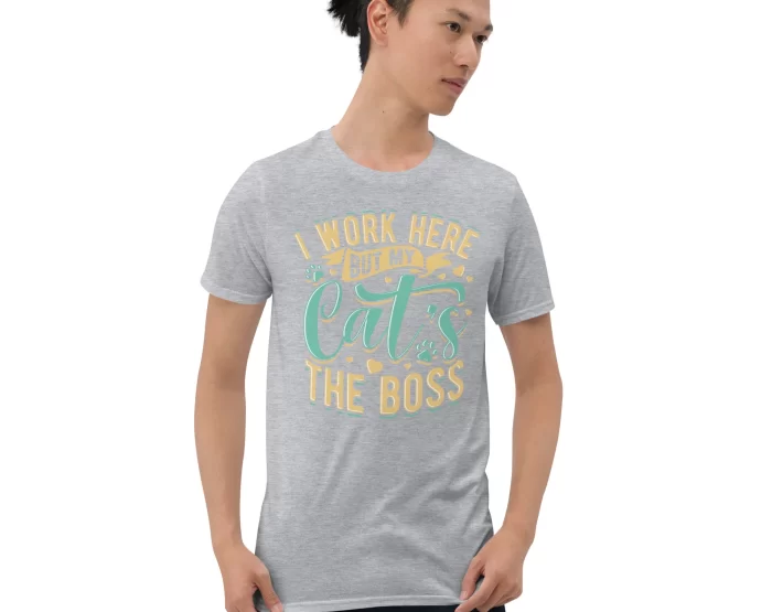 Man modeling light gray "Cat’s the Boss" t-shirt with casual pose and confident expression
