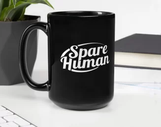 black-glossy-mug-black-handle-on-left Black Spare Human mug on white desk next to computer and green plant