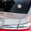 Minimalist Spare Human Society logo sticker on rear windshield of a silver car