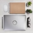 Black and white Spare Human Society logo decal on laptop with glasses and notebook