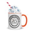 Ceramic mug with orange handle and pet-themed logo design reading Spare Human Society