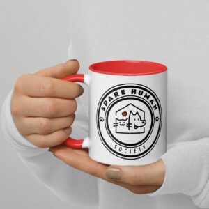 Ceramic mug with orange handle and pet-themed logo design reading Spare Human Society.