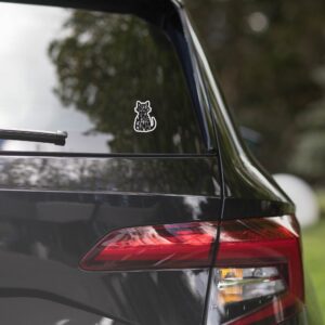 Weatherproof Proud Spare Human sticker on rear windshield of a silver car