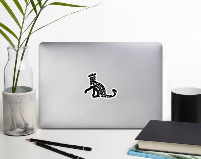 rescue-cat-parent-sticker-minimalist-desk Weatherproof cat sticker reading I Love Rescue Cats placed on laptop in minimalist workspace