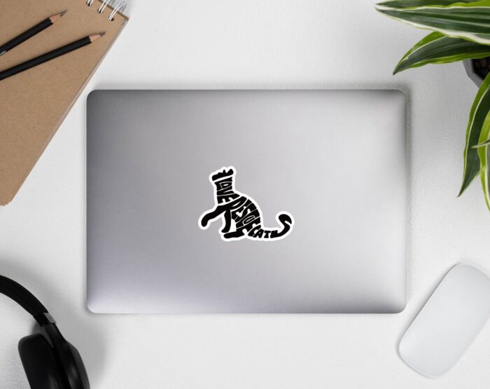 vinyl-cat-sticker-on-laptop-desk-view I Love Rescue Cats vinyl sticker shown on silver laptop near headphones, mouse, and plant