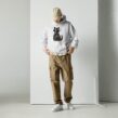 Man wearing a white cat hoodie for men with Proud Spare Human graphic in black cat silhouette