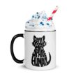 White ceramic mug with black handle featuring Proud Spare Human design and whipped topping