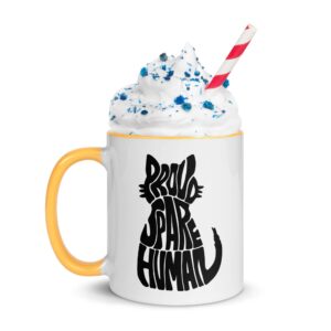 Proud Spare Human cat mug with yellow handle and rim, topped with whipped cream and sprinkles