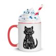 White mug with red handle and Proud Spare Human cat graphic filled with whipped cream