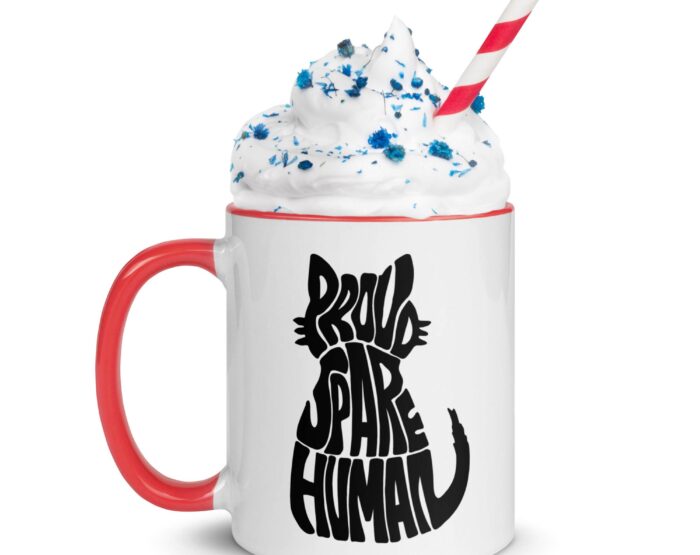 cat-lover-mug-red-handle-funny-coffee-cup White mug with red handle and Proud Spare Human cat graphic filled with whipped cream