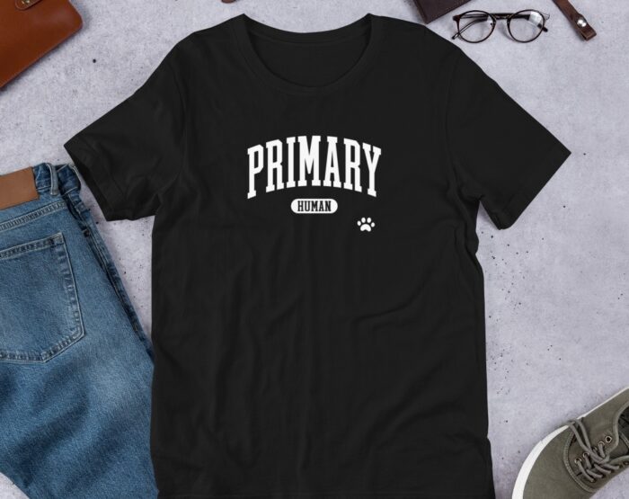 unisex-staple-t-shirt-black-front-68f91a861098b.jpg primary human shirt on t shirt with pants and shoes on layout.